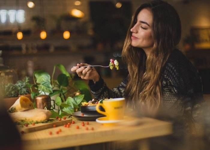 a woman enjoying her food