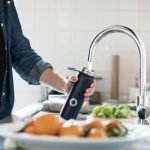 a man filled his flask with tap water
