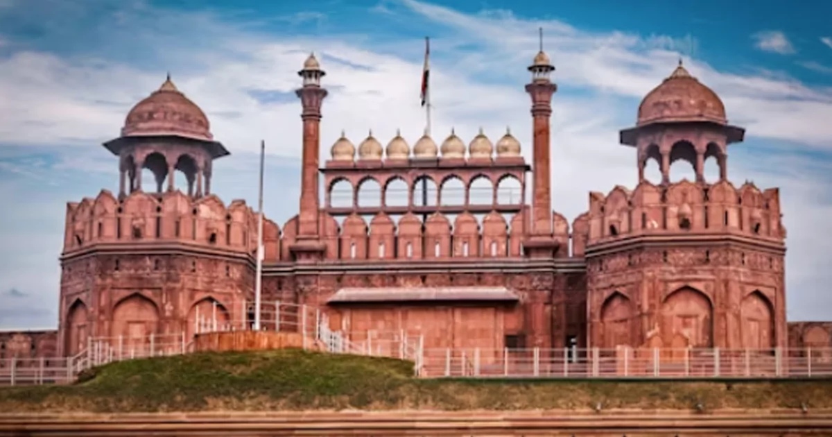 Red Fort in Delhi with towers under blue sky, gateway to India's heritage