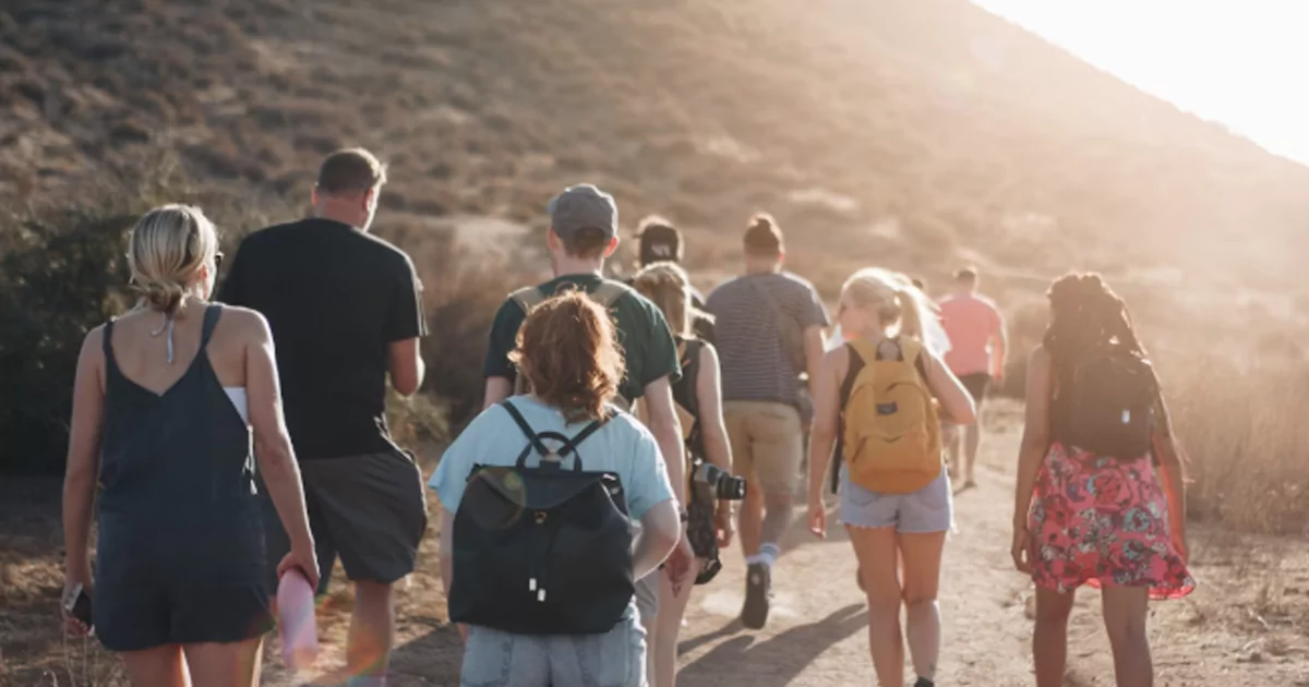 Group of travelers walking together on a nature trail during a Golden Triangle tour 