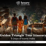 Tourists on steps overlooking historic Indian city, Golden Triangle Tour