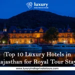Luxurious hotel by river at night with hills, top 10 Rajasthan royal stays