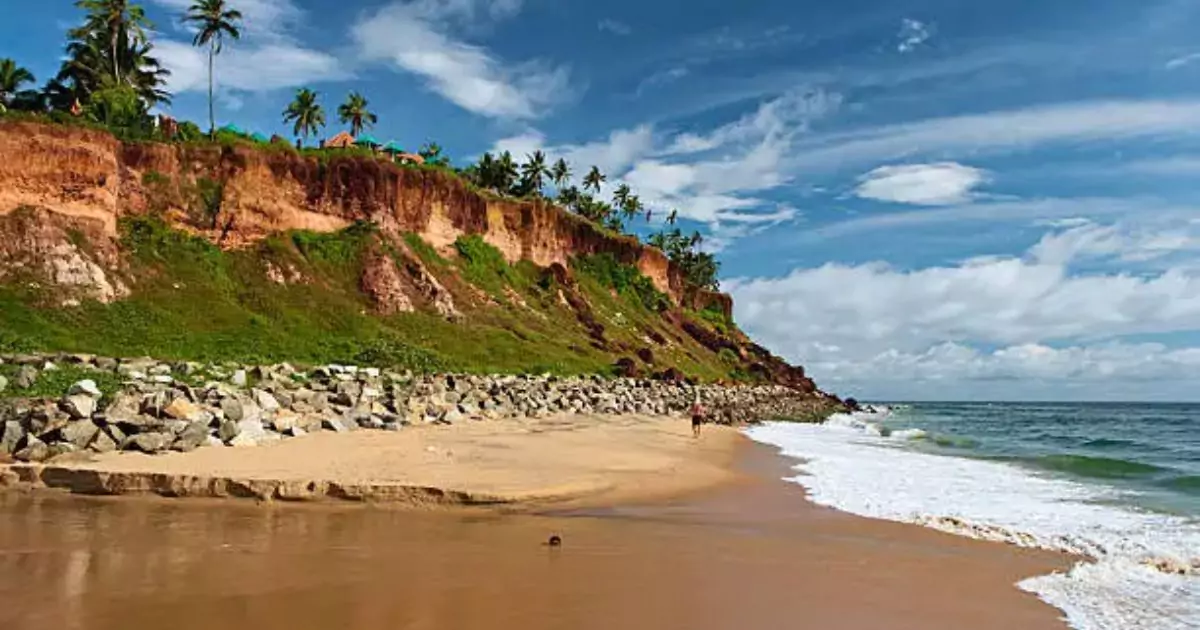 Varkala Beach with cliffs, palm trees, and scenic sea view 